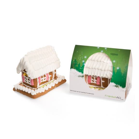 Lebkuchenhaus als Werbeartikel mit weißer Zuckerglasur und farbigen Details, ergänzt durch individuell bedruckte Kartonverpackung der Fränkel AG.