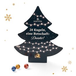 Adventskalender mit Lindt Schokolade auf weißem Hintergrund
