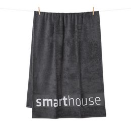 Dickes Logo-Saunahandtuch mit Jacquard-Bordüreneinwebung: 100% Baumwolle.