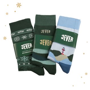 Verschiedene Sockenpaare individuell gestaltet mit Banderole als Verpackung für Jever